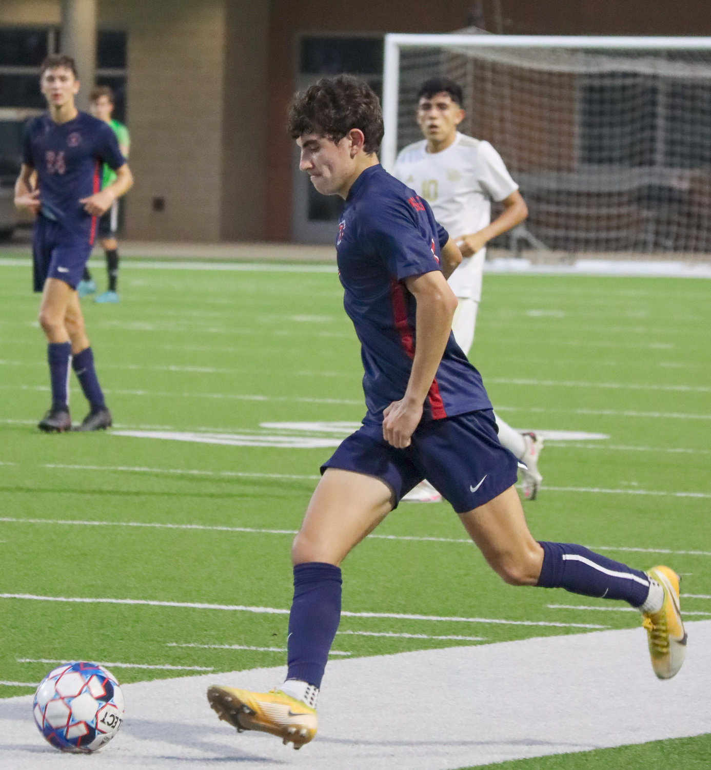 Tompkins sophomore Diego Castellano prepares to strike the ball during Tompkins’ Class 6A Region III final against Jersey Village on Friday, April 9, at Legacy Stadium.
